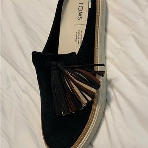 Black suede mules with tassel